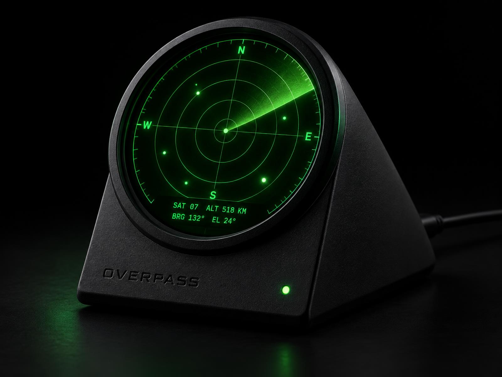 OVERPASS angled wedge desk device with a glowing green circular radar display